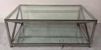 A contemporary chrome and glass X frame coffee table H46cm W120cm D70cm Condition Report Scratches
