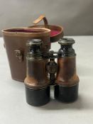 A set of War Office binoculars in original brown leather case.