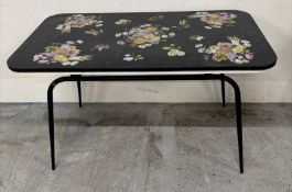 A vintage kitchen table with floral pattern formica top on metal legs H70cm W120cm D68cm Condition