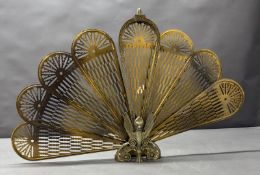 A brass folding 'Griffin and Peacock' firescreen Condition Report In need of repair
