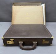 A brown leather Gucci briefcase with brass fixings in its original box Condition Report box