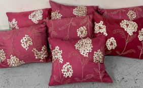 Seven cushions with floral theme