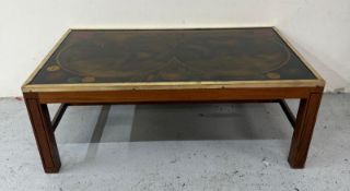 A reverse-painted atlas map topped coffee table with a brass frame H39cm W104cm D62cm Condition
