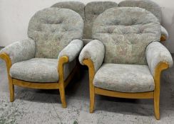 A Mis Century three-piece suite sitting on a wooden frame with light green upholstery Condition