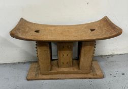 A vintage Ashanti ceremonial stool H29cm W47cm D20cm