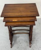 A nest of three tables on turned legs (H57cm x 34cm x 50cm)