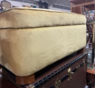 A green fabric ottoman H48cm W96cm D64cm