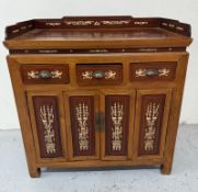 A Chinese sideboard or server with bone inlay, comprising of three short drawers over two door