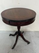 An occasional drum table with two drawers, centre column on brass castors H60cm Dia51cm Condition