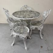 A white painted circular table and four chairs H67cm Dia82cm