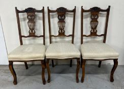 A set of three Edwardian hall chairs with carved backs on cabriole legs Condition Report repairs