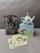 Alice in Wonderland, two novelty teapots and four metal wall signs