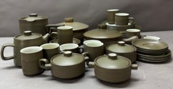 A quantity of Denby cookware and crockery to include cups, saucers and a teapot