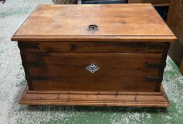 A wooden chest with metal banding 78cm x 50cm