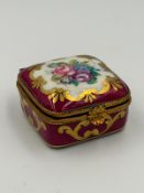 A small hand painted French porcelain pot retailed by Art Cho Paris Rivoli