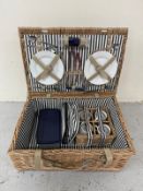 A wicker four person picnic set to include plates, cups etc Condition Report Excellent condition,