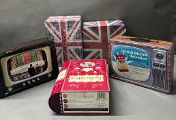 Five metal storage tins