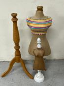 Two mannequins and a mannequin stand