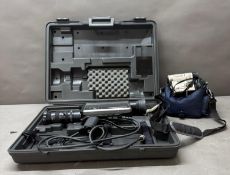 A Hitachi GP-4DE/K tube based video camera together with a sharp digital camcorder