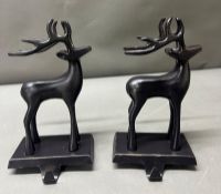 A pair of stocking holders in the form of stags H24cm