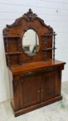 A mahogany chiffonier comprising of a single long drawer over two door cupboard, a mirrored