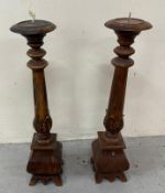 A pair of wooden carved candlesticks H65cm Condition Report CRACK AND SOME CHIPS