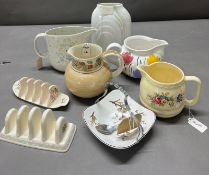 A selection of ceramic jugs, toast racks etc