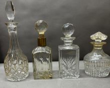 A selection of four glass decanters in various styles and conditions