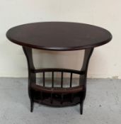 A mahogany oval magazine rack or side table (H56cm W59cm D39cm) Condition Report small marks