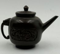 An antique Chinese bronze teapot with dragon theme.Height approximate 7.5cm