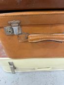 Four vintage suitcases various styles and sizes