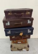 Six vintage suitcases various sizes