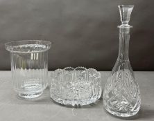 A cut glass decanter and bowl together with a Dartington crystal vase.