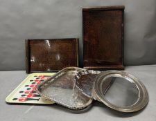 A selection of lacquer, metal and plastic trays