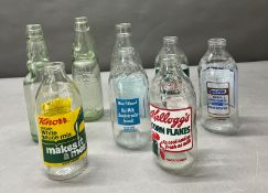 A collection of milk bottles and vintage bottles