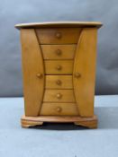 A light wood jewellery armoire with six drawers (H35 x 27cm x 14cm)