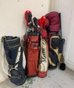 A selection of golf bags and clubs various makers