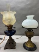Two oil lamps converted to lamps, one brass the other is cast metal.