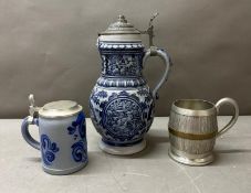 Two stoneware German steins and a white metal tankard