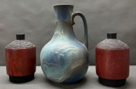 A pair of red ground bamboo style vases together with a blue/grey pitcher Condition Report SOME