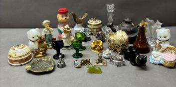 A variety of collectable figurines and pottery to include Royal Doulton, Royal Albert and various