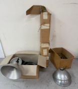 A selection of industrial style light fittings and tripods.