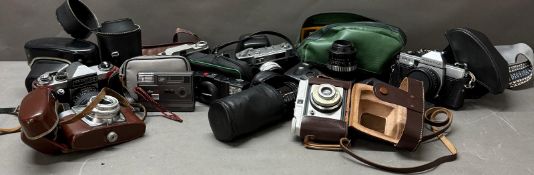 A Large selection of cameras and camera equipment, various makers.