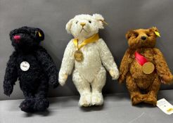 Three Steiff teddies, black, white and brown