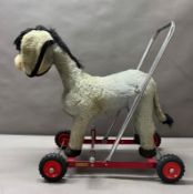 A Merrythought donkey child's stroller