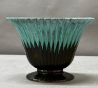 A Canadian Evangeline pottery footed vase in a teal blue and black drip pattern H15cm