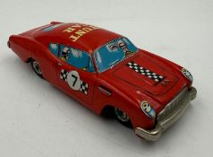 A vintage tin toy Stunt car