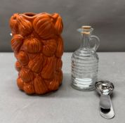 A Collective lot: Pumpkin vase, glass oil or vinaigrette jug, and a coffee measuring spoon.