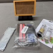 A Little bit of everything: small glass photo frame, pair of brand new luggage straps, brand new
