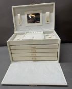 A faux white leather vanity case by Rowling